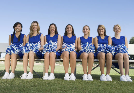 cheerleaders sitting on bench (portrait)