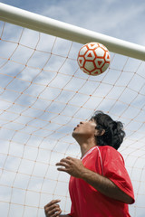 Soccer Player Heading a Ball