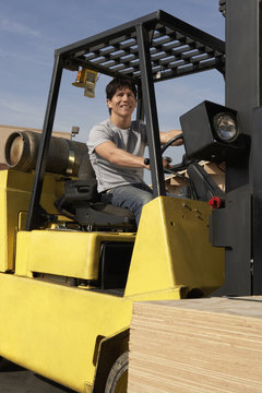 Man Operating Forklift Outside