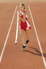 athlete running with pole vault
