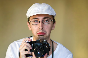 Isolated photographer with camera is crying