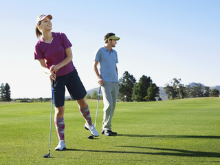 two young golfers on course