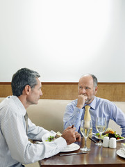 Businessmen Eating at Restaurant