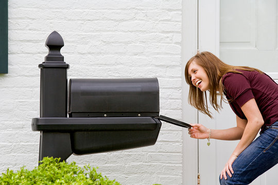 Young Woman Checking for Mail