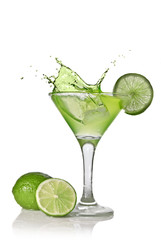Green alcohol cocktail with splash and green lime