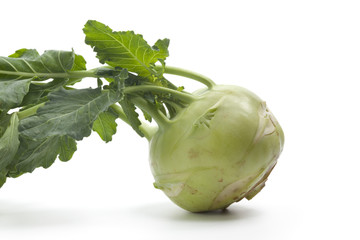 Whole fresh green kohlrabi on white background