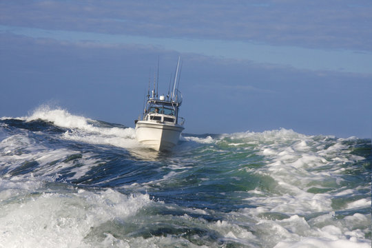 Pleasure Craft Style Sport Fishing Boat Navigating Rough Seas