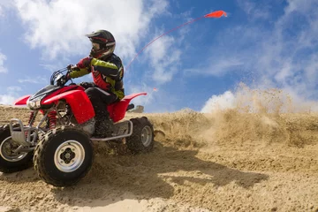 Fotobehang ATV rider spray sand in dunes © Raven