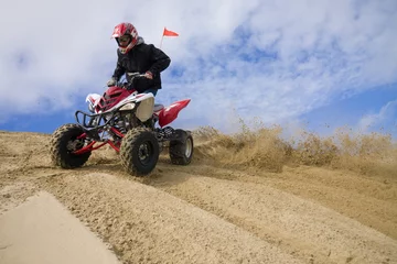 Foto op Aluminium ATV rider spray sand in dunes © Raven