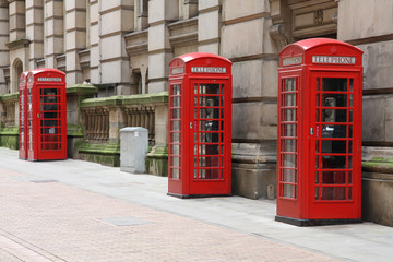 Birmingham red telephone boxes. England.