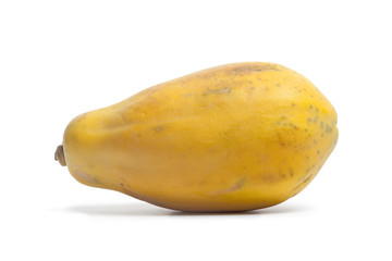 One whole yellow papaya on white background