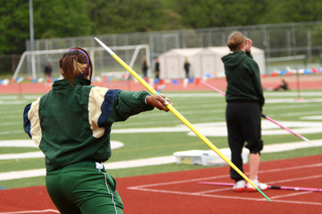 Female athlete throwing javelin.