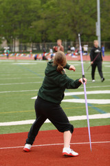 Female athlete throwing javelin.