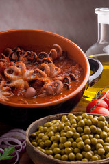 bowl with octopus and tomato sauce
