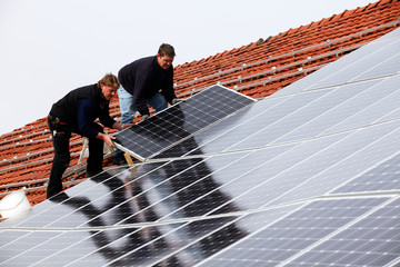 installing solar modules on a roof 07