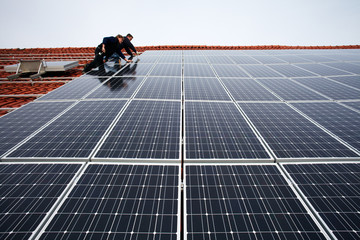 installing solar modules on a roof 10