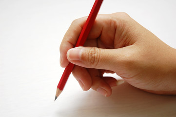 close up of hand with pencil with white background