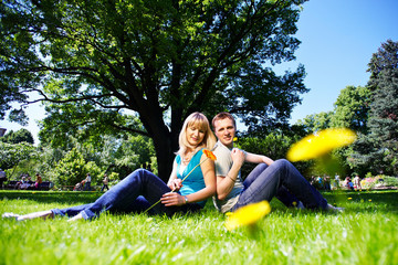 Happy man and woman with flowers
