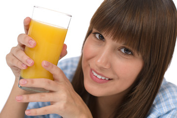 Female teenager with healthy juice for breakfast