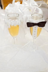 bride and groom glasses on wedding veil with selective focus