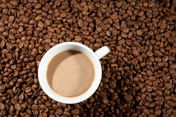 Cup with coffee, costing on coffee grain