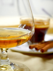 Close up a glass of cognac and coffee