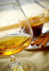 Close up a glass of cognac and coffee