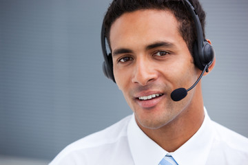 Portrait of a handsome customer service agent at work