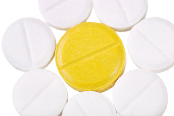 Various tablets and vitamins on white