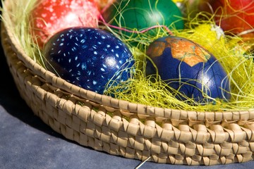 Coloring Easter eggs in basket