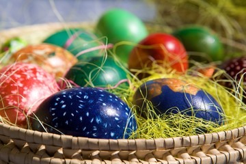 Coloring Easter eggs in basket