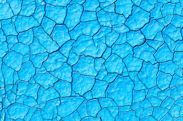 cracked blue paint surface as grunge background