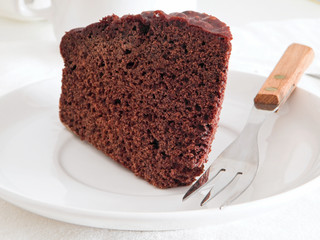 Chocolate Cake Slice on white dish.
