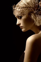 Sepia toned portrait of attractive retro-style girl in bonnet
