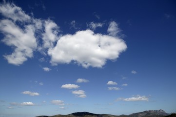 Fototapeta premium Blue sky white clouds in a summer clean day, nature