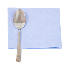 spoon on blue napkin