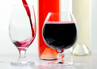 Red and white wine in glasses and bottles