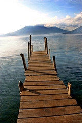 Boat dock on lake with volcano- Lake Atitlan, Guatemala