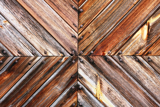 Wooden board pattern and rusty nails heads