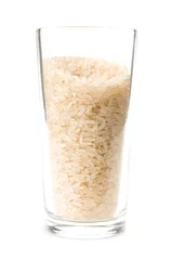 Poster Dry rice in a transparent glass on a white background © VASilyeV A.S.