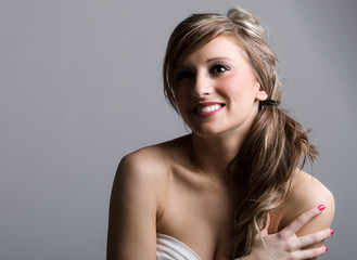 Fototapeta premium Beautiful Shot of a Happy Teenager against Grey Background
