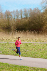 Lady Jogging in a Park