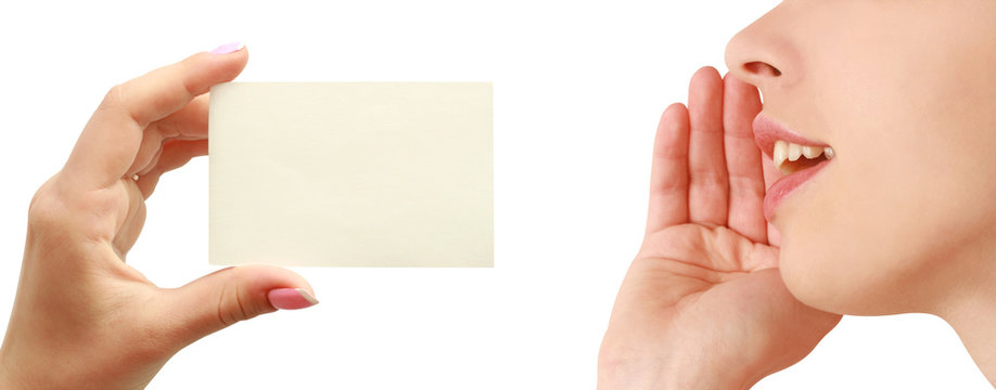 Women talking, business card in hand