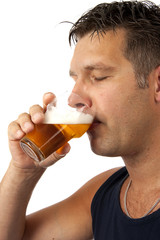 Fototapeta premium Man drinks beer over white background
