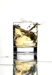 Beautiful splash of ice in the glass