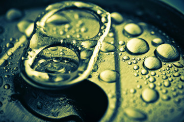 close up opened jar with water drops