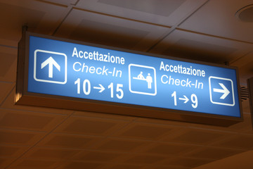 Airport sign in English and Italian language