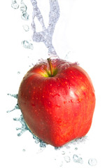 Water splash on a fresh red apple