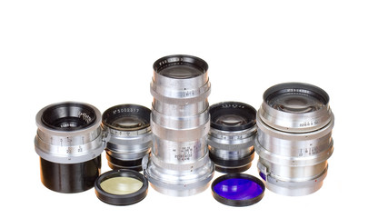 Old lens and filters on white background