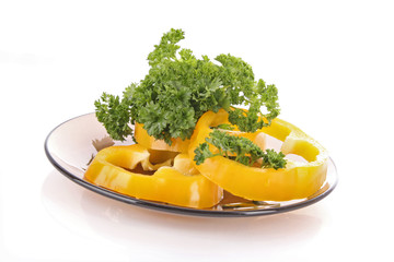 Orange pepper and parsley on white background